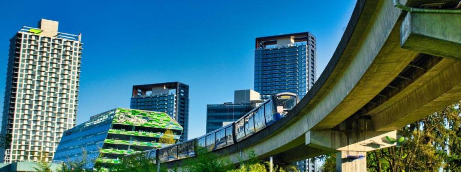 SkyTrain leaves King George Boulevard Station in Whalley/City Centre