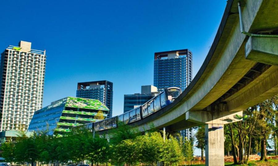 SkyTrain leaves King George Boulevard Station in Whalley/City Centre