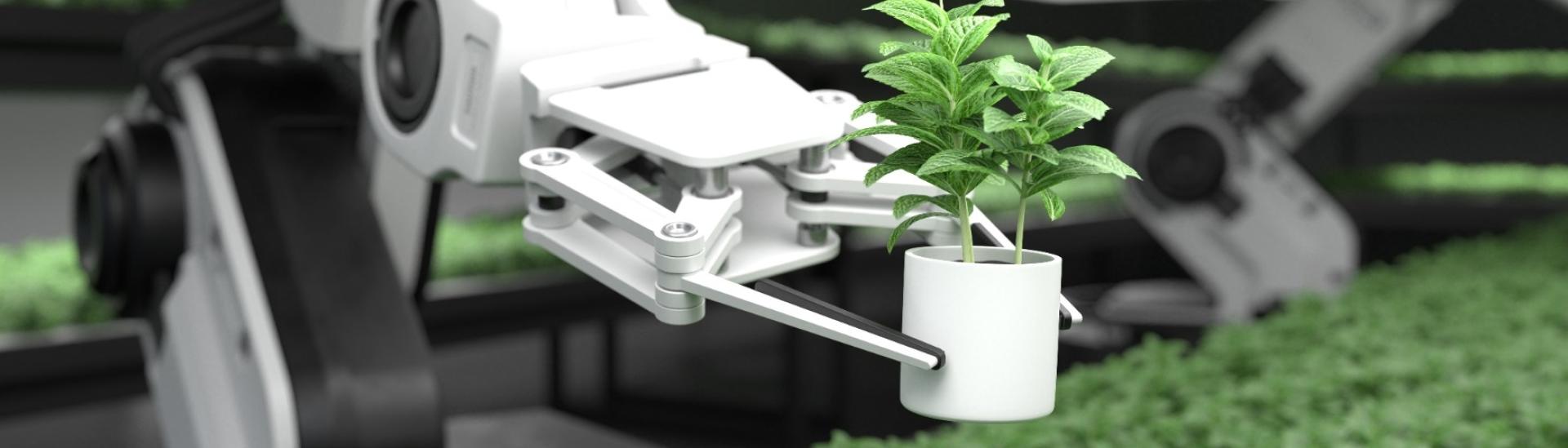 A robotic arm lifts a plant